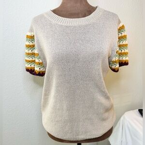 Dreamers by Debut Beige Short Sleeve Sweater with crocheted flutter sleeves.